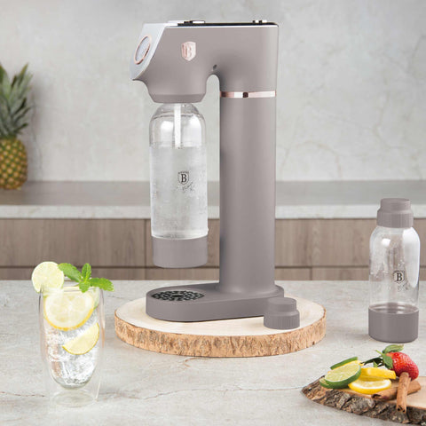 Product image of Soda maker with 2bottles and barometer universal CO2cylinders size. Part of the Taupe Collection . Features: • Material: stainless steel, pp • Size: 43,5*22*12 cm • 2 pcs pp bottle with cup: 1,0L and 0,5L • Universal, standard CO2 cylinders size (not inclu.... (Studio view). Official Berlinger Haus product, boosted by Promintra sl.