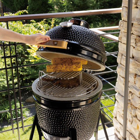 Product image of Compact Kamado grill. Part of the outdoor . Features: • Material: ceramic, stainless steel • Thermometer in the top (lid) • Accessories, features: • Sectional firebox • Heat deflector • Plate setter • .... (Studio view). Official Berlinger Haus product, boosted by Promintra sl.
