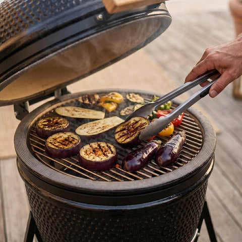Product image of Compact Kamado grill. Part of the outdoor . Features: • Material: ceramic, stainless steel • Thermometer in the top (lid) • Accessories, features: • Sectional firebox • Heat deflector • Plate setter • .... (Studio view). Official Berlinger Haus product, boosted by Promintra sl.