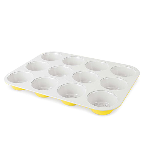 Product image of 12cups muffin pan. Part of the Minions Collection . Features: • Material: carbon steel with titanPro non-stick coating • Size: 35*26,5*3 cm • Color: yellow. (Studio view). Official Berlinger Haus product, boosted by Promintra sl.