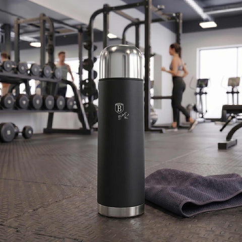 Product image of Vacuum flask 1,0L. Part of the Matte Black Collection . Features: • Material: inner body 18/10 stainless steel with matt powder coating • Capacity: 1,0 L • Color: black- silver • Packing: half giftbox. (Studio view). Official Berlinger Haus product, boosted by Promintra sl.