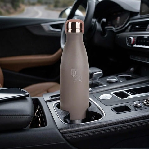 Product image of Vacuum flask bottle shape 0,5L. Part of the Taupe Collection . Features: • Material: inner body 18/10 stainless steel with matt powder coating • Capacity: 0,5 L • Color: matt taupe • Packing: half giftbox. (Studio view). Official Berlinger Haus product, boosted by Promintra sl.