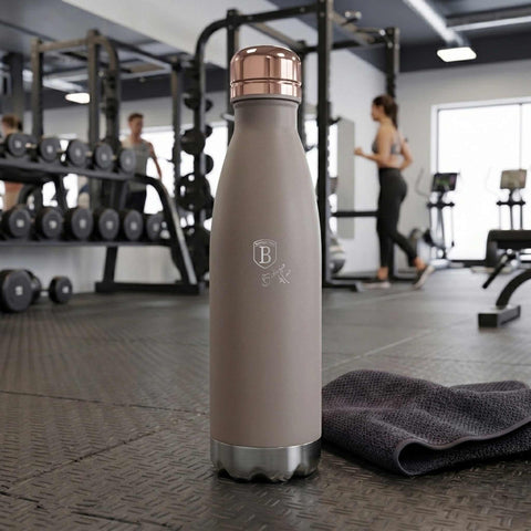 Product image of Vacuum flask bottle shape 0,5L. Part of the Taupe Collection . Features: • Material: inner body 18/10 stainless steel with matt powder coating • Capacity: 0,5 L • Color: matt taupe • Packing: half giftbox. (Studio view). Official Berlinger Haus product, boosted by Promintra sl.