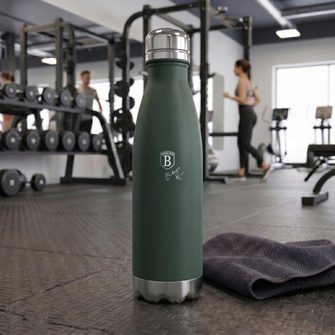 Product image of Vacuum flask bottle shape 0,5L. Part of the Matte Green Collection . Features: • Material: inner body 18/10 stainless steel with matt powder coating • Capacity: 0,5 L • Color: matt green • Packing: half giftbox. (Studio view). Official Berlinger Haus product, boosted by Promintra sl.