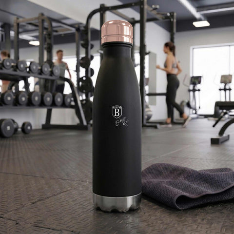 Product image of Vacuum flask bottle shape 0,5L. Part of the Black Rose Collection . Features: • Material: inner body 18/10 stainless steel with matt powder coating • Capacity: 0,5 L • Color: matt black- rose gold • Packing: half giftbox. (Studio view). Official Berlinger Haus product, boosted by Promintra sl.