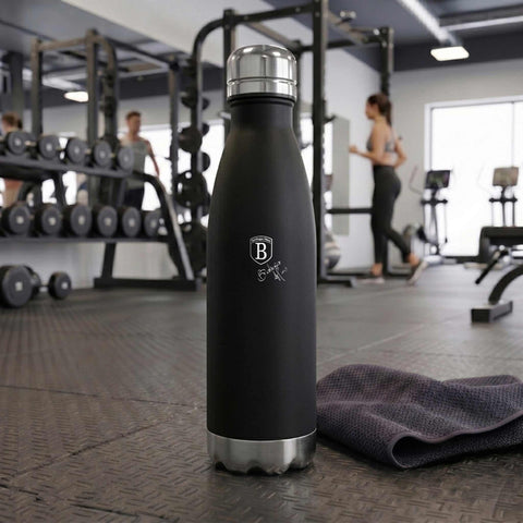 Product image of Vacuum flask bottle shape 0,5L. Part of the Matte Black Collection . Features: • Material: inner body 18/10 stainless steel with matt powder coating • Capacity: 0,5 L • Color: black- silver • Packing: half giftbox. (Studio view). Official Berlinger Haus product, boosted by Promintra sl.