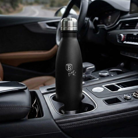 Product image of Vacuum flask bottle shape 0,5L. Part of the Matte Black Collection . Features: • Material: inner body 18/10 stainless steel with matt powder coating • Capacity: 0,5 L • Color: black- silver • Packing: half giftbox. (Studio view). Official Berlinger Haus product, boosted by Promintra sl.