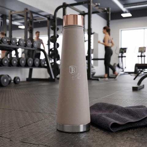 Product image of Vacuum flask bottle shape 0,4L. Part of the Taupe Collection . Features: • Material: inner body 18/10 stainless steel with matt powder coating • Capacity: 0,4 L • Color: matt taupe • Packing: half giftbox. (Studio view). Official Berlinger Haus product, boosted by Promintra sl.