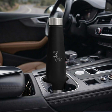 Product image of Vacuum flask bottle shape 0,4L. Part of the Matte Green Collection . Features: • Material: inner body 18/10 stainless steel with matt powder coating • Capacity: 0,4 L • Color: matt green • Packing: half giftbox. (Studio view). Official Berlinger Haus product, boosted by Promintra sl.