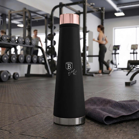 Product image of Vacuum flask bottle shape 0,4L. Part of the Black Rose Collection . Features: • Material: inner body 18/10 stainless steel with matt powder coating • Capacity: 0,4 L • Color: black- rose gold • Packing: half giftbox. (Studio view). Official Berlinger Haus product, boosted by Promintra sl.