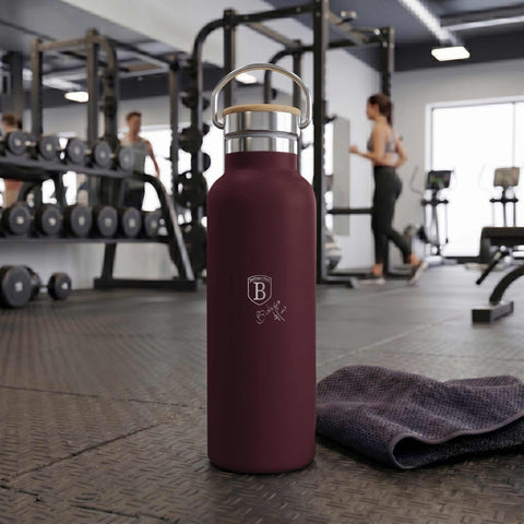 Product image of Flask with bamboo lid 0,6L. Part of the Leonardo Collection . Features: • Material: 18/10 stainless steel with matt powder coating • Bamboo lid • Capacity: 0,6 L • Color: matt bordeaux • Packing: giftbox. (Studio view). Official Berlinger Haus product, boosted by Promintra sl.