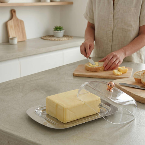 Product image of Butter dish with lid. Part of the Metallic Line Rose Gold Edition . Features: • Material: stainless steel, plastic • Size: 18,7*12,3*7,8 cm. (Conceptual view). Official Berlinger Haus product, boosted by Promintra sl.