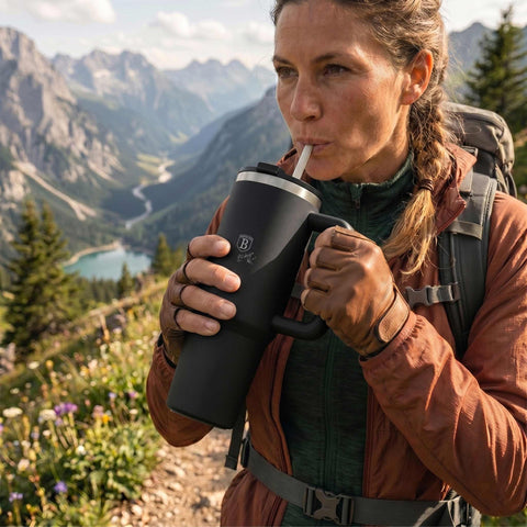 Product image of Thermo mug 1L. Part of the Matte Black Collection . Features: • Material: 18/10 stainless steel, cap: plastic, with matt powder coating • Capacity: 1 L • Accessories: • 30 cm straw • Color: black • Packing: ha.... (Studio view). Official Berlinger Haus product, boosted by Promintra sl.