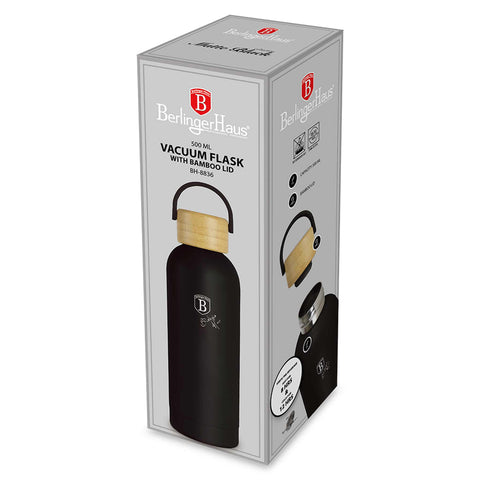 Product image of Vacuum flask with bamboo lid 0,5L. Part of the Matte Black Collection . Features: • Material: 18/10 stainless steel with matt powder coating • Bamboo lid • Capacity: 0,5 L • Color: black • Packing: giftbox. (Studio view). Official Berlinger Haus product, boosted by Promintra sl.