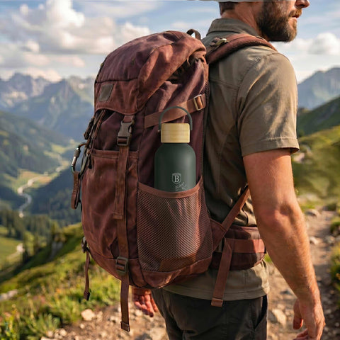Product image of Vacuum flask with bamboo lid 0,5L. Part of the Matte Green Collection . Features: • Material: 18/10 stainless steel with matt powder coating • Bamboo lid • Capacity: 0,5 L • Color: matt green • Packing: giftbox. (Studio view). Official Berlinger Haus product, boosted by Promintra sl.