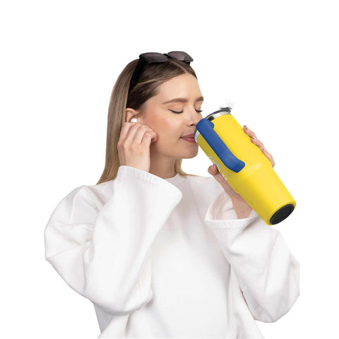 Product image of Thermo mug 1L. Part of the Minions Collection . Features: • Material: 18/10 stainless steel, cap: plastic, with matt powder coating • Capacity: 1 L • Accessories: • 30 cm straw • Color: yellow- blue • Pack.... (Studio view). Official Berlinger Haus product, boosted by Promintra sl.