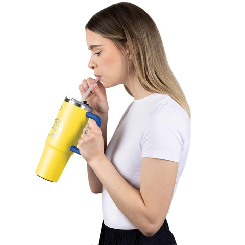 Product image of Thermo mug 1L. Part of the Minions Collection . Features: • Material: 18/10 stainless steel, cap: plastic, with matt powder coating • Capacity: 1 L • Accessories: • 30 cm straw • Color: yellow- blue • Pack.... (Studio view). Official Berlinger Haus product, boosted by Promintra sl.