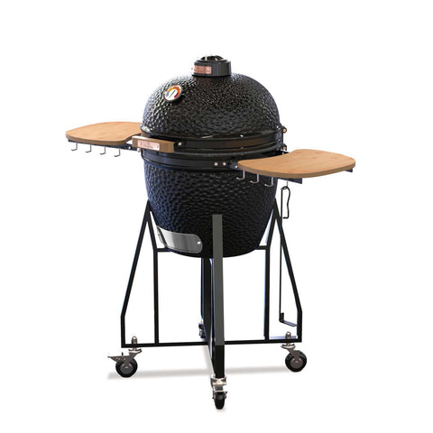 Product image of Kamado grill with high stand and side shelves. Part of the outdoor . Features: • Material: ceramic, stainless steel, bamboo • Thermometer in the top (lid) • Accessories, features: • Regular firebox • Heat deflector • Plate set.... (Studio view). Official Berlinger Haus product, boosted by Promintra sl.