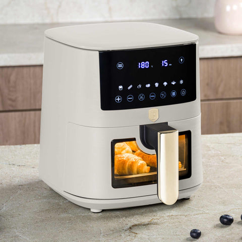 Product image of Air fryer 5L visible window. Part of the Sahara Collection . Features: • Power: 220-240V ~ 1400W • Temperature control: 40-200℃ • Include: • XL SIZE: food basket with non-stick coating 5L • DIGITAL • Color: matt cream. (Studio view). Official Berlinger Haus product, boosted by Promintra sl.