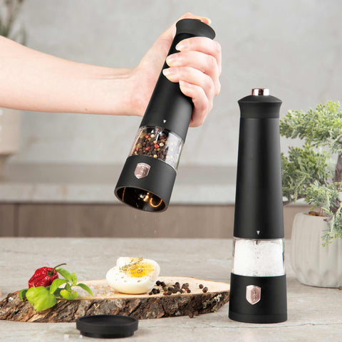 Product image of Electric pepper and salt mill 2pcs set. Part of the Black Rose Collection . Features: • Material: plastic with CERAMIC grinder • Batteries: 4 pcs AAA (not inc.) • WITH LIGHT • Color: black- rose gold • 2 pcs set. (Studio view). Official Berlinger Haus product, boosted by Promintra sl.
