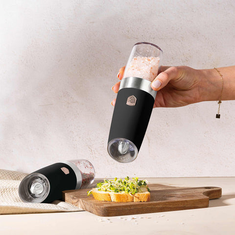 Product image of Gravity pepper and salt mill 2pcs set. Part of the Black Rose Collection . Features: • Material: plastic with CERAMIC grinder • Batteries: 6 pcs AAA (not inc.) • WITH LIGHT • Color: black- rose gold • 2 pcs set. (Conceptual view). Official Berlinger Haus product, boosted by Promintra sl.