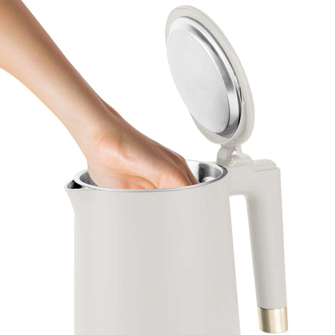 Product image of Double wall kettle. Part of the Sahara Collection . Features: • Material: 18/10 stainless steel inside, plastic outside • Capacity: 1,7L • Voltage: 220-240V,50/60Hz • Power: 1800 W • Color: matt cream. (Studio view). Official Berlinger Haus product, boosted by Promintra sl.