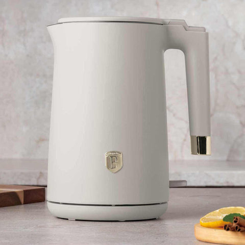 Product image of Double wall kettle. Part of the Sahara Collection . Features: • Material: 18/10 stainless steel inside, plastic outside • Capacity: 1,7L • Voltage: 220-240V,50/60Hz • Power: 1800 W • Color: matt cream. (Studio view). Official Berlinger Haus product, boosted by Promintra sl.