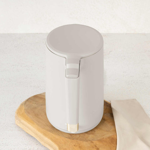 Product image of Double wall kettle. Part of the Sahara Collection . Features: • Material: 18/10 stainless steel inside, plastic outside • Capacity: 1,7L • Voltage: 220-240V,50/60Hz • Power: 1800 W • Color: matt cream. (Studio view). Official Berlinger Haus product, boosted by Promintra sl.