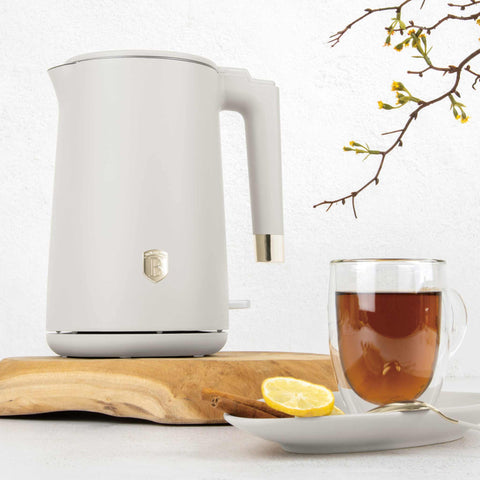 Product image of Double wall kettle. Part of the Sahara Collection . Features: • Material: 18/10 stainless steel inside, plastic outside • Capacity: 1,7L • Voltage: 220-240V,50/60Hz • Power: 1800 W • Color: matt cream. (Studio view). Official Berlinger Haus product, boosted by Promintra sl.