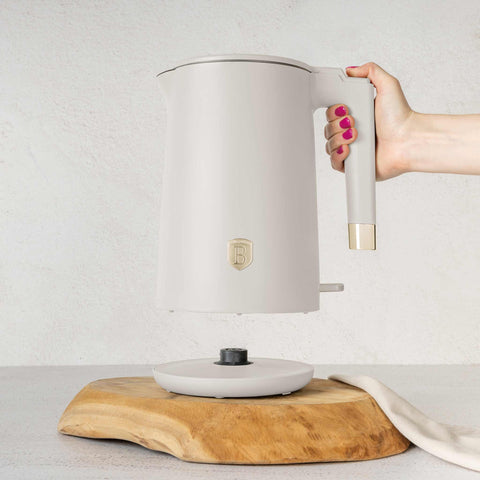 Product image of Double wall kettle. Part of the Sahara Collection . Features: • Material: 18/10 stainless steel inside, plastic outside • Capacity: 1,7L • Voltage: 220-240V,50/60Hz • Power: 1800 W • Color: matt cream. (Studio view). Official Berlinger Haus product, boosted by Promintra sl.