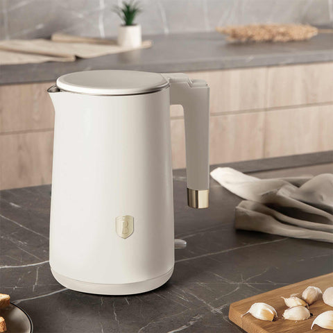 Product image of Double wall kettle. Part of the Sahara Collection . Features: • Material: 18/10 stainless steel inside, plastic outside • Capacity: 1,7L • Voltage: 220-240V,50/60Hz • Power: 1800 W • Color: matt cream. (Studio view). Official Berlinger Haus product, boosted by Promintra sl.