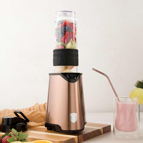 Product image of Smoothie maker. Part of the Metallic Line Rose Gold Edition . Features: • Material: stainless steel, plastic • Power: 300 W • 220-240 V 50/60 Hz • Takeaway jar with lid: 570 ml • Color: rose gold. (Studio view). Official Berlinger Haus product, boosted by Promintra sl.