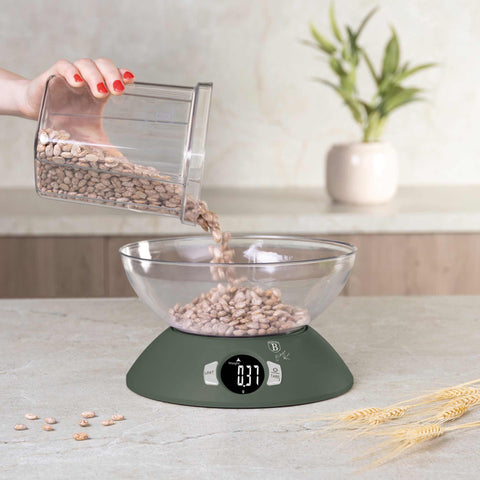 Product image of Kitchen scale with bowl. Part of the Matte Green Collection . Features: • Material: plastic • LCD display • Capacity: 5 kg • AAA battery included • Accessories: • Measuring cup: 25 ml • Egg separator • Color: matt green. (Conceptual view). Official Berlinger Haus product, boosted by Promintra sl.