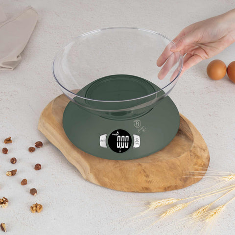 Product image of Kitchen scale with bowl. Part of the Matte Green Collection . Features: • Material: plastic • LCD display • Capacity: 5 kg • AAA battery included • Accessories: • Measuring cup: 25 ml • Egg separator • Color: matt green. (Conceptual view). Official Berlinger Haus product, boosted by Promintra sl.