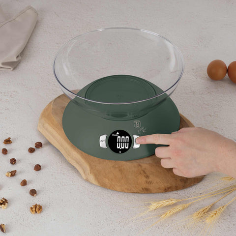 Product image of Kitchen scale with bowl. Part of the Matte Green Collection . Features: • Material: plastic • LCD display • Capacity: 5 kg • AAA battery included • Accessories: • Measuring cup: 25 ml • Egg separator • Color: matt green. (Conceptual view). Official Berlinger Haus product, boosted by Promintra sl.