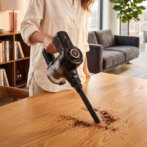 Product image of Vacuum cleaner. Part of the Black Rose Collection . Features: • Voltage: 22,2 V (Li-ION battery) • 165 W • 12Kpa powerful suction • Accessories: • 2 in 1 brush with LED ligths • Long crevice tool • Sofa brush .... (Studio view). Official Berlinger Haus product, boosted by Promintra sl.