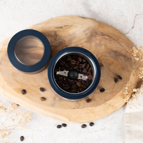 Product image of Electric coffee grinder. Part of the Deep Sea Collection . Features: • Power: 150 W • 220V-240V 50/60 Hz • Stainless steel bowl • Stainless steel blades • Color: mat blue. (Studio view). Official Berlinger Haus product, boosted by Promintra sl.