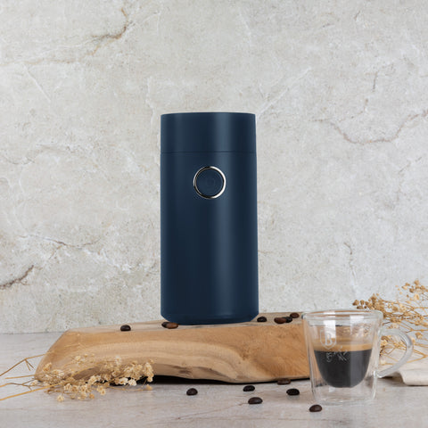 Product image of Electric coffee grinder. Part of the Deep Sea Collection . Features: • Power: 150 W • 220V-240V 50/60 Hz • Stainless steel bowl • Stainless steel blades • Color: mat blue. (Studio view). Official Berlinger Haus product, boosted by Promintra sl.