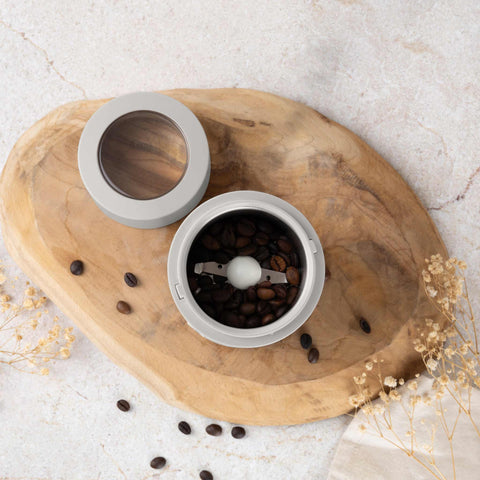 Product image of Electric coffee grinder. Part of the Sahara Collection . Features: • Power: 150 W • 220V-240V 50/60 Hz • Stainless steel bowl • Stainless steel blades • Color: cream. (Studio view). Official Berlinger Haus product, boosted by Promintra sl.