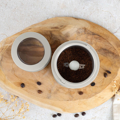 Product image of Electric coffee grinder. Part of the Sahara Collection . Features: • Power: 150 W • 220V-240V 50/60 Hz • Stainless steel bowl • Stainless steel blades • Color: cream. (Studio view). Official Berlinger Haus product, boosted by Promintra sl.