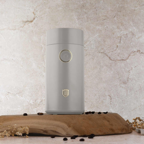 Product image of Electric coffee grinder. Part of the Sahara Collection . Features: • Power: 150 W • 220V-240V 50/60 Hz • Stainless steel bowl • Stainless steel blades • Color: cream. (Studio view). Official Berlinger Haus product, boosted by Promintra sl.
