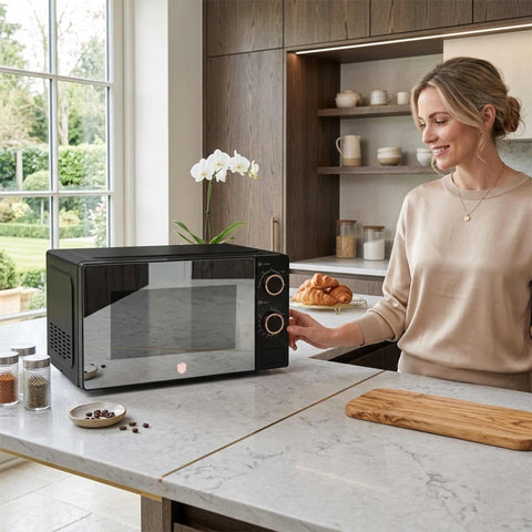 Product image of Mechanical microwave oven 20L. Part of the Black Rose Collection . Features: • Input power: 1100W • Output power: 700W • Capacity: 20L • Glass plate: Ø24,5 cm • Size: 24,2*44,5*32,5 cm • Length of power cord: 85 cm • Color: .... (Studio view). Official Berlinger Haus product, boosted by Promintra sl.