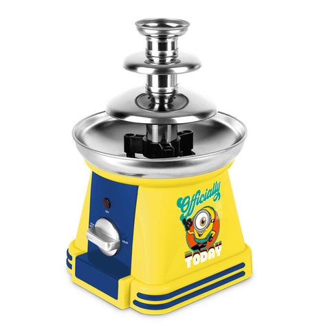 Product image of Chocolate fountain. Part of the Minions Collection . Features: • Material: stainless steel, plastic • 220-240 V, 50/60Hz, 32 W • Capacity: 50g • Size: 15*15*24 cm • Length of power cord: 1 m • Color: yellow- blue. (Studio view). Official Berlinger Haus product, boosted by Promintra sl.