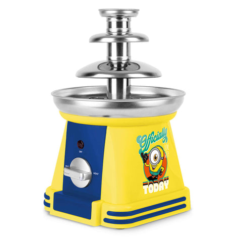 Product image of Chocolate fountain. Part of the Minions Collection . Features: • Material: stainless steel, plastic • 220-240 V, 50/60Hz, 32 W • Capacity: 50g • Size: 15*15*24 cm • Length of power cord: 1 m • Color: yellow- blue. (Studio view). Official Berlinger Haus product, boosted by Promintra sl.