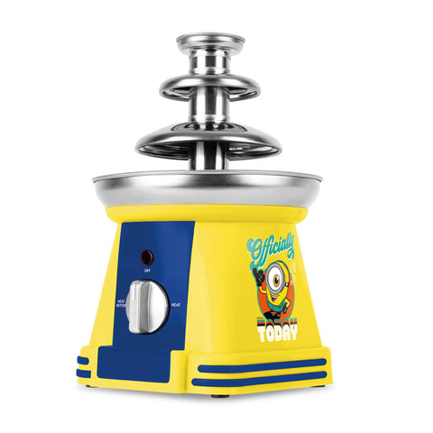 Product image of Chocolate fountain. Part of the Minions Collection . Features: • Material: stainless steel, plastic • 220-240 V, 50/60Hz, 32 W • Capacity: 50g • Size: 15*15*24 cm • Length of power cord: 1 m • Color: yellow- blue. (Studio view). Official Berlinger Haus product, boosted by Promintra sl.