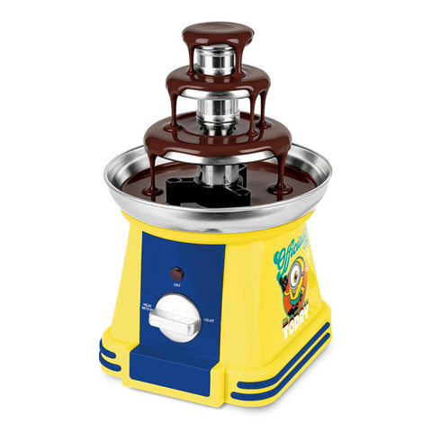 Product image of Chocolate fountain. Part of the Minions Collection . Features: • Material: stainless steel, plastic • 220-240 V, 50/60Hz, 32 W • Capacity: 50g • Size: 15*15*24 cm • Length of power cord: 1 m • Color: yellow- blue. (Studio view). Official Berlinger Haus product, boosted by Promintra sl.