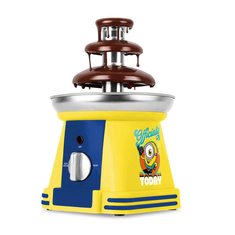 Product image of Chocolate fountain. Part of the Minions Collection . Features: • Material: stainless steel, plastic • 220-240 V, 50/60Hz, 32 W • Capacity: 50g • Size: 15*15*24 cm • Length of power cord: 1 m • Color: yellow- blue. (Studio view). Official Berlinger Haus product, boosted by Promintra sl.