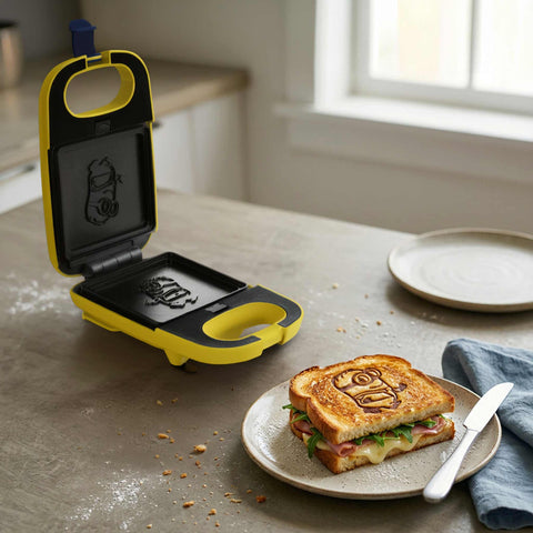 Product image of 3in1 sandwich maker with detachable plates. Part of the Minions Collection . Features: • Material: aluminium, plastic • Power: 600 W • Voltage: 220-240 V, 50/60Hz • Plate size: 13,1*12 cm • NON-STICK coating • Size: 14,5*25*9 cm • Len.... (Studio view). Official Berlinger Haus product, boosted by Promintra sl.