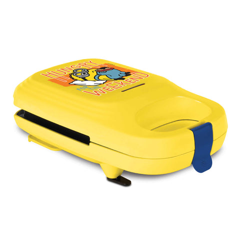 Product image of Sandwich maker. Part of the Minions Collection . Features: • Material: aluminium, plastic • Power: 600 W • Voltage: 220-240 V, 50/60Hz • Plate size: 13,1*12 cm • NON-STICK coating • Size: 14,5*25*9 cm • Len.... (Studio view). Official Berlinger Haus product, boosted by Promintra sl.