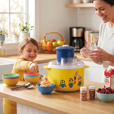Product image of Ice cream maker. Part of the Minions Collection . Features: • Material: aluminium, plastic • 220-240V 50/60Hz 12W • Capacity: 1,1L • Include: • Aluminium bowl • Stirring paddle • Length of power cord: 70 cm .... (Studio view). Official Berlinger Haus product, boosted by Promintra sl.